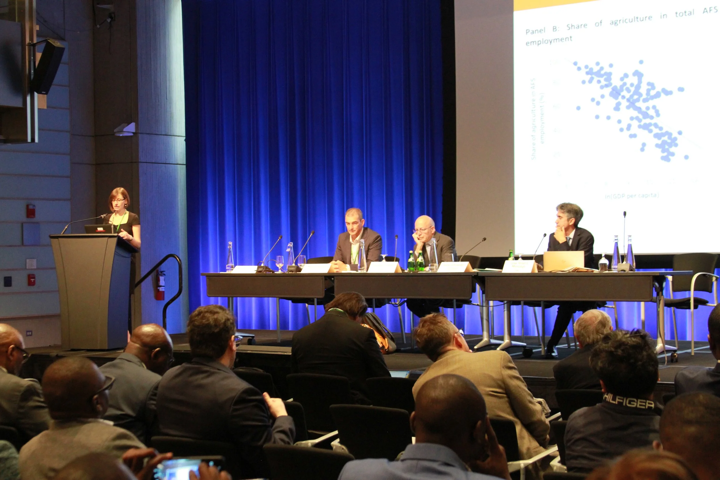 Kate Schneider Lecy presenting to a full room